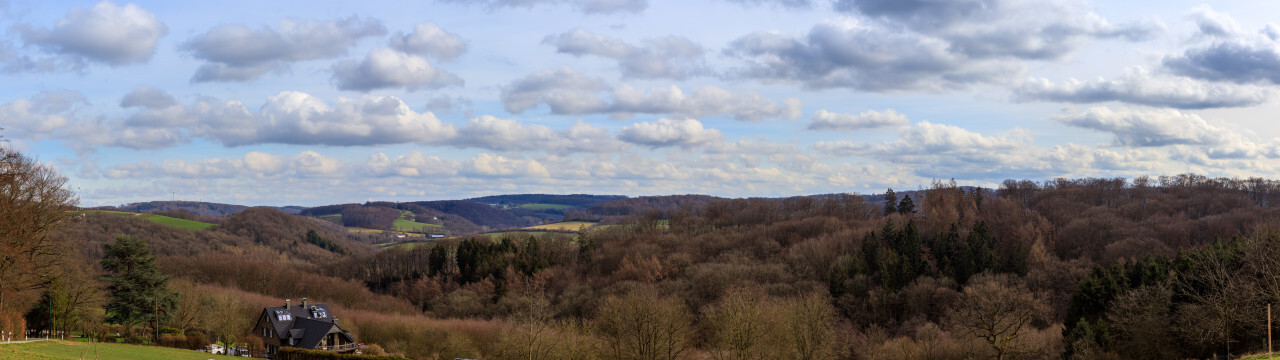 German rural landscape in early spring with hills and forests