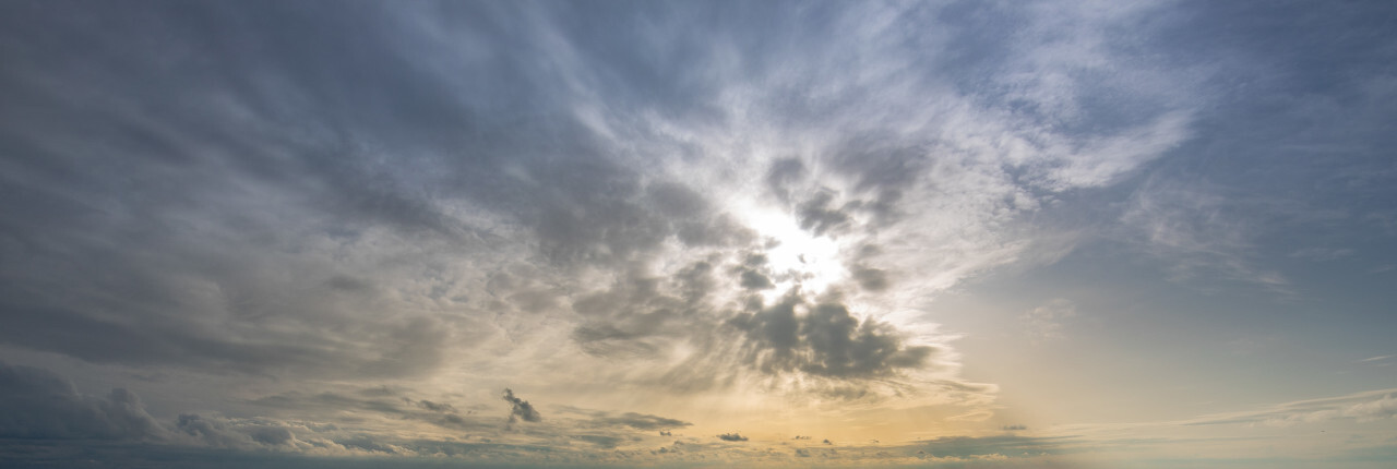 silky soft clouds in the sky behind them the sun