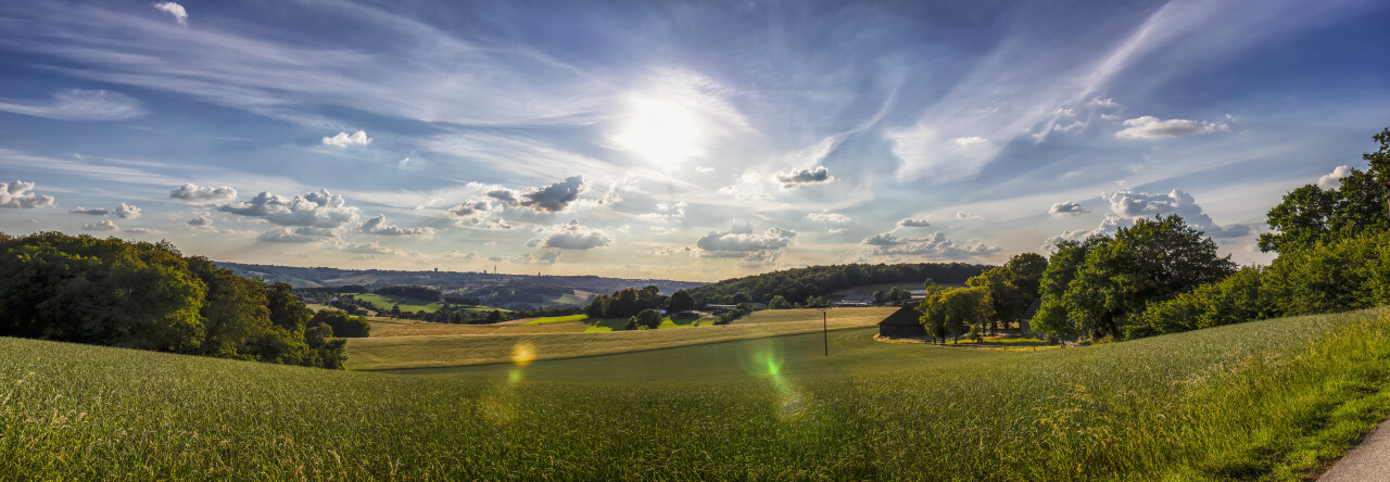 Rural Landscape in Germany with the Sun in the middle during the golden hour