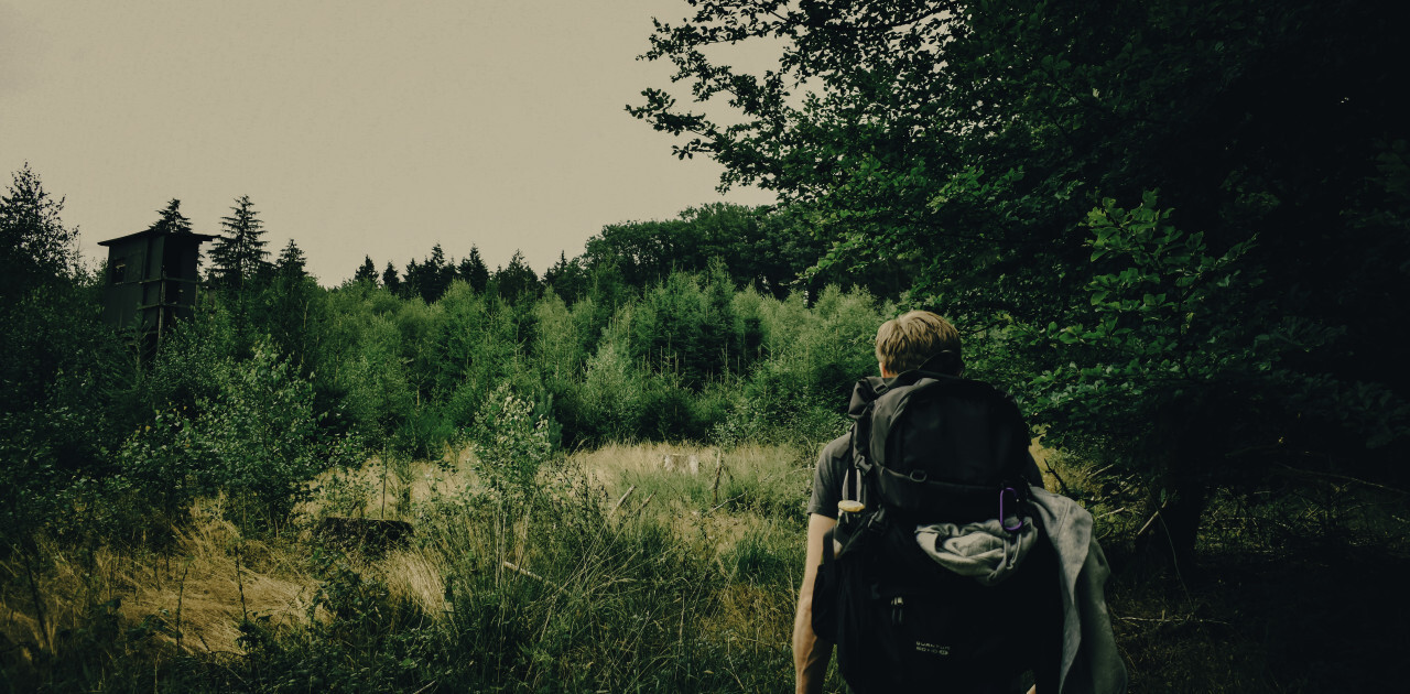 backpack traveler in the forest