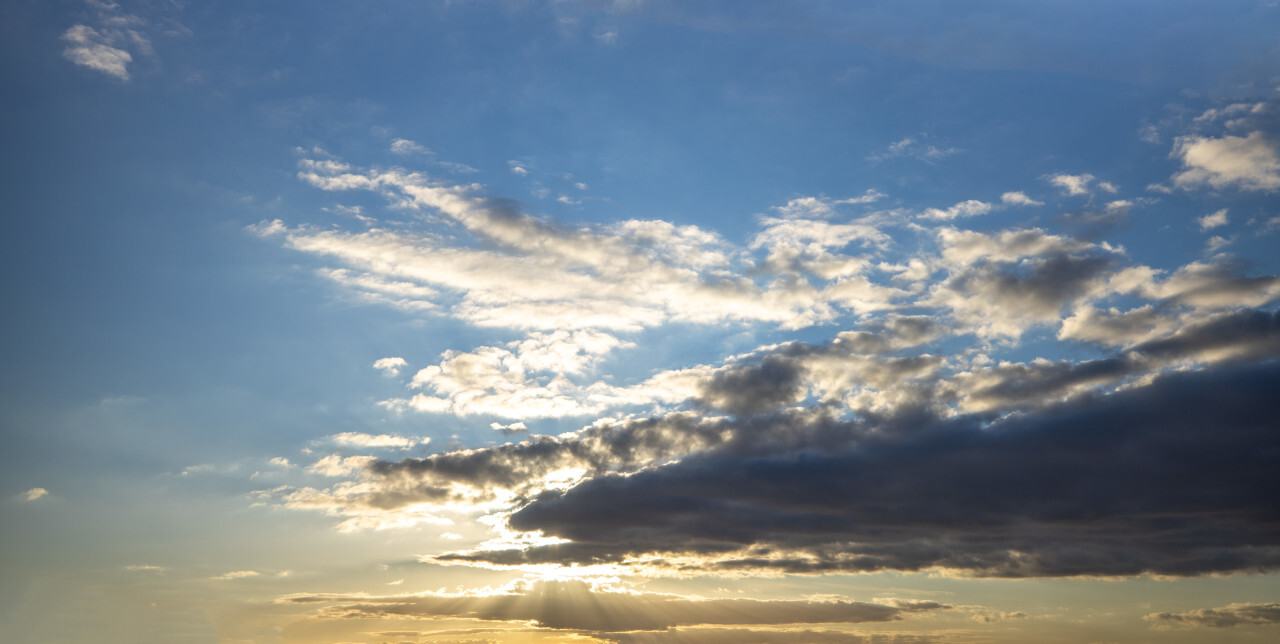 Sun behind dramatic clouds