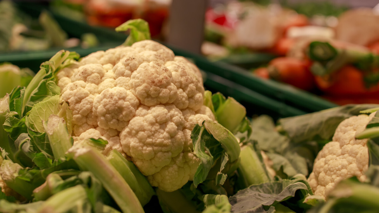 fresh cauliflower on market stall