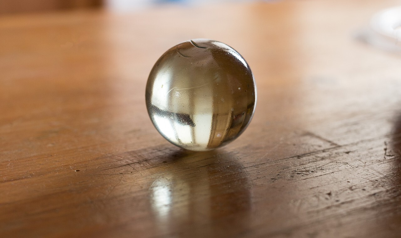glass marble on a wooden table