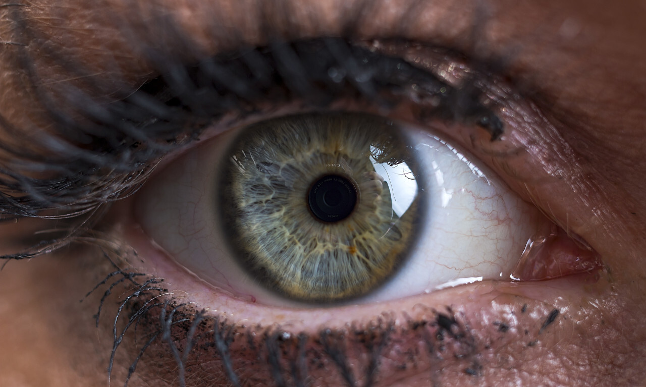female human eye greenish