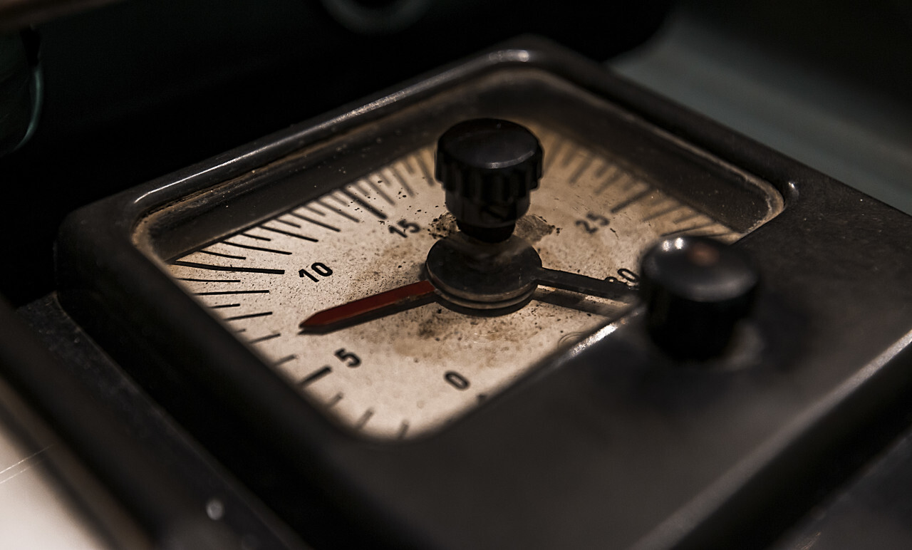 Old measuring device on an vintage control panel