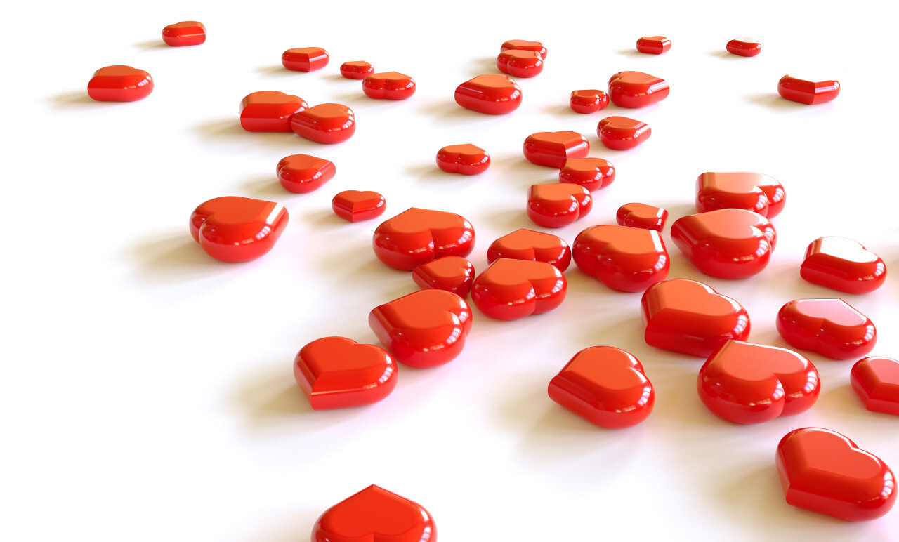 Heap of red hearts on white background