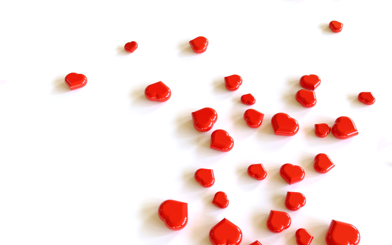 Heap of red hearts on white background