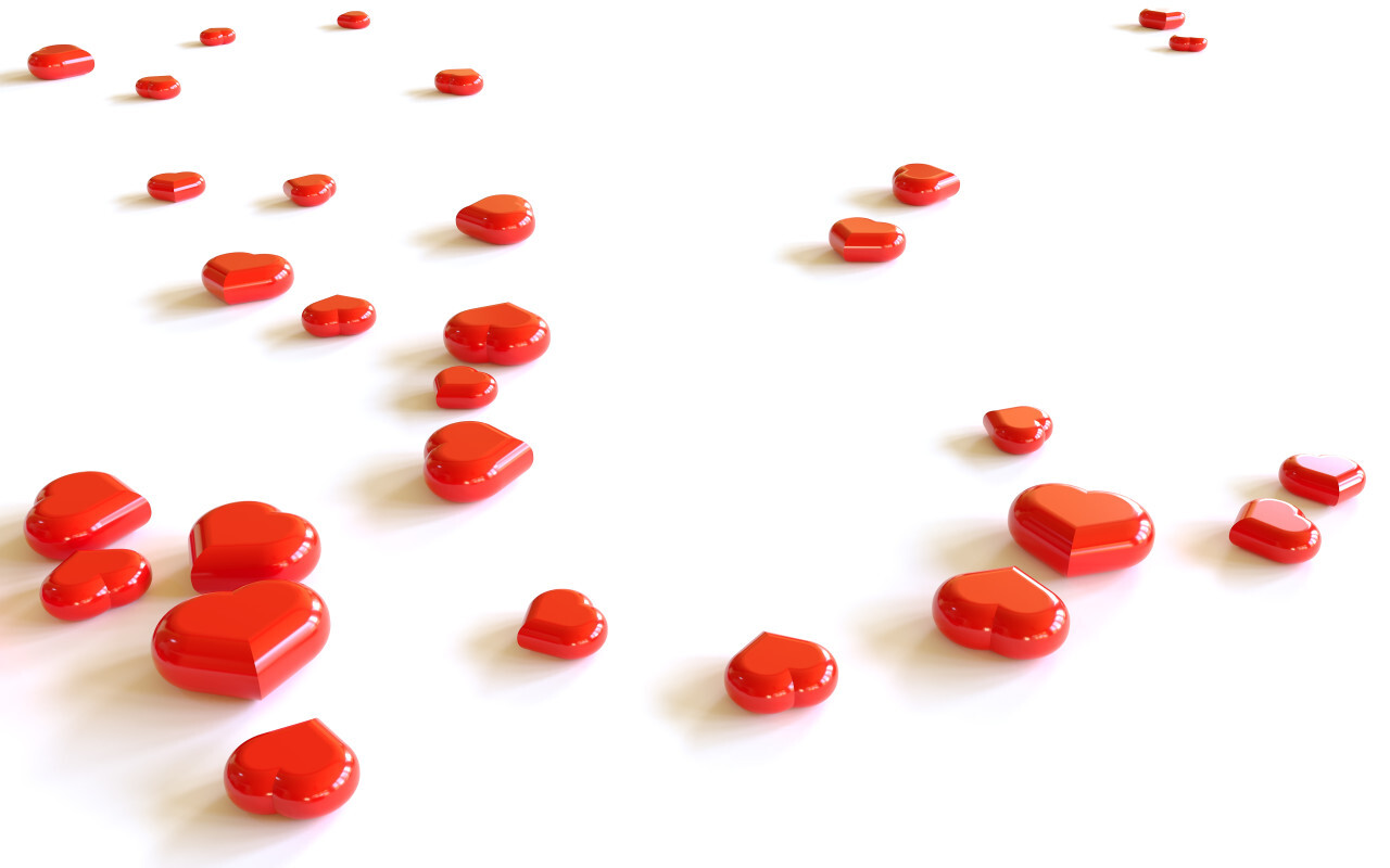 Heap of red hearts on white background