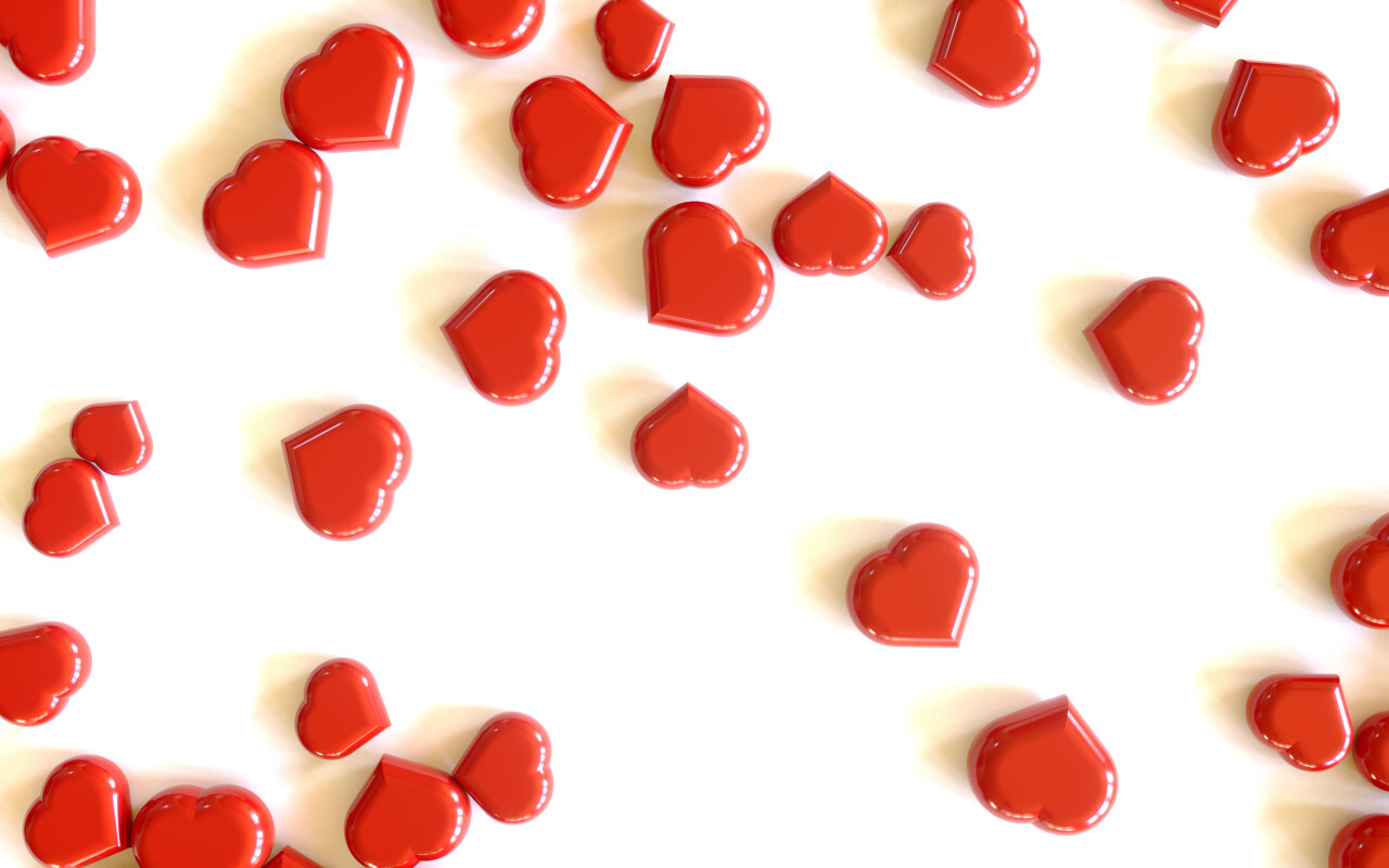 Heap of red hearts on white background