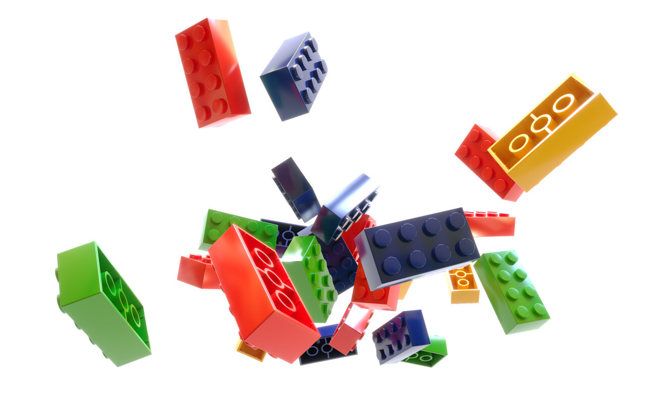 Heap of color plastic toy bricks isolated on white background