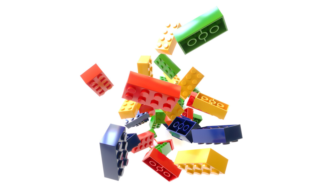 Heap of color plastic toy bricks isolated on white background