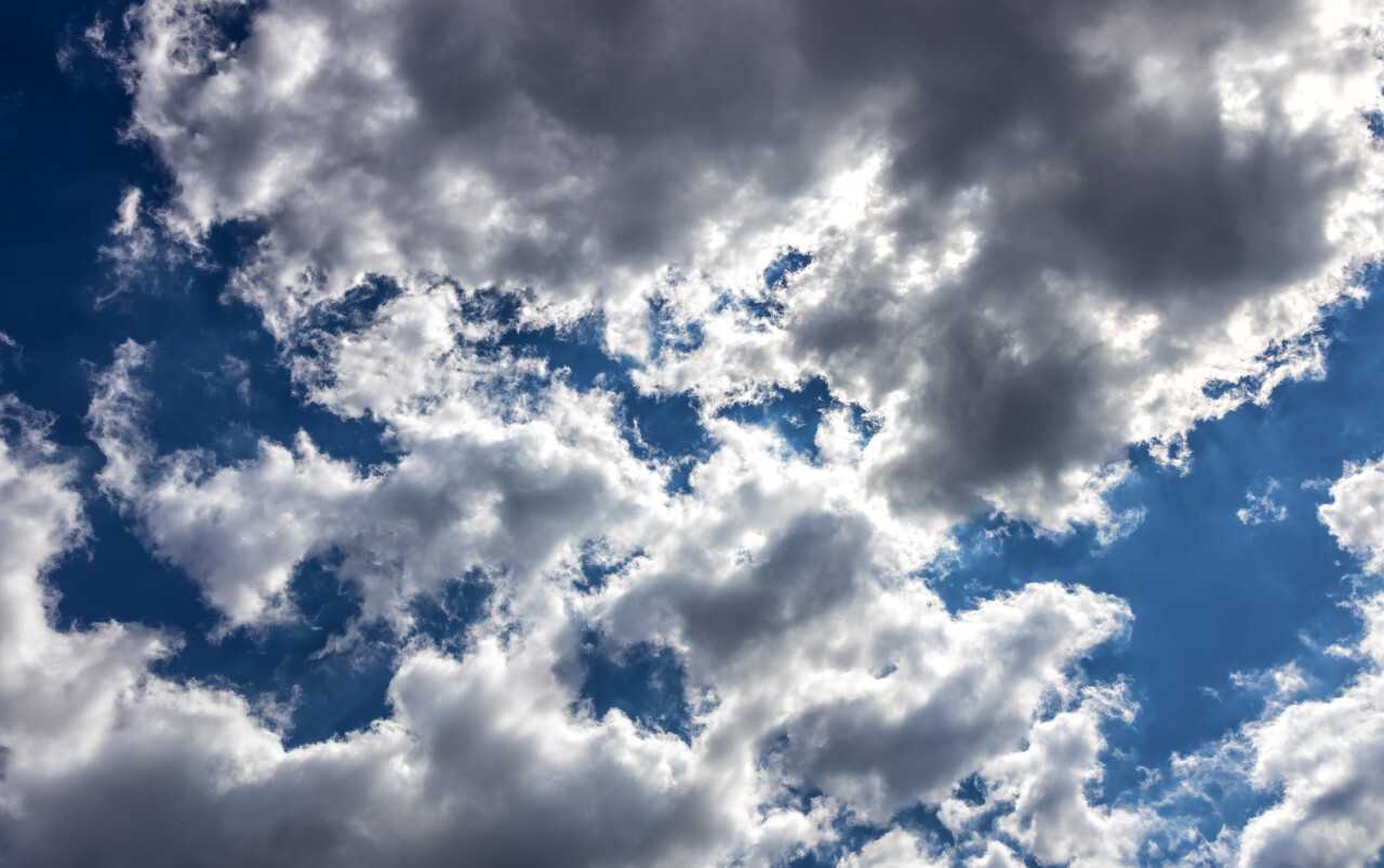 Beautiful Blue Sky with fluffy Clouds