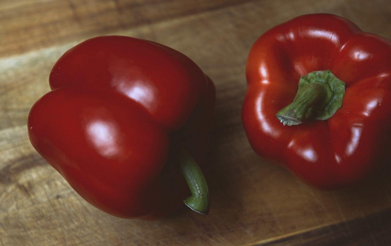 red paprika on wooden board