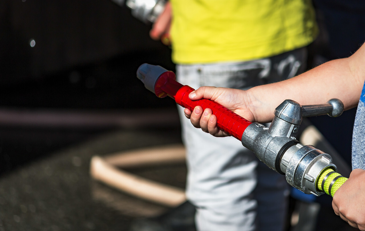 fire hose in child hand