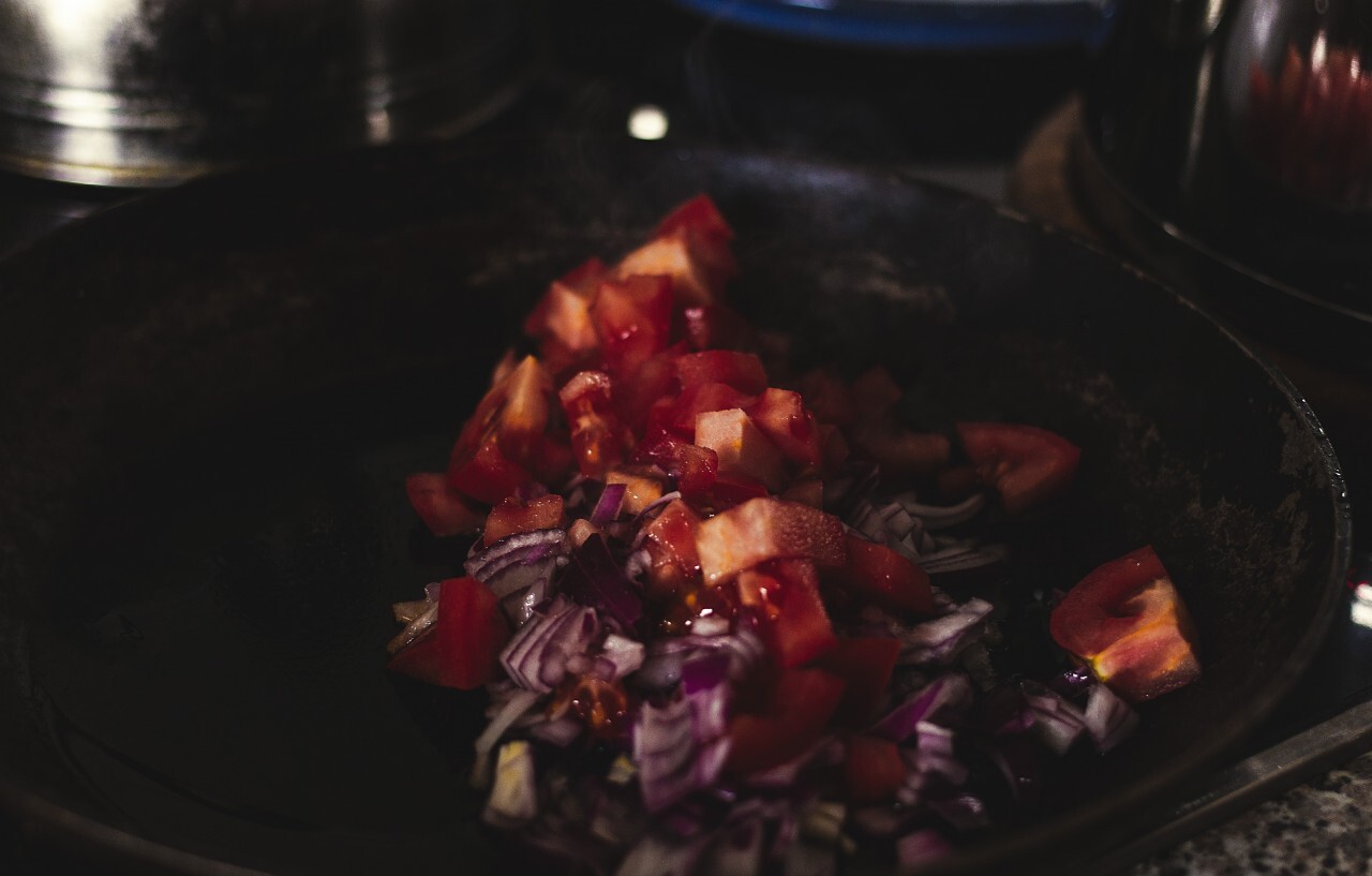 tomatoes and onions in a pan