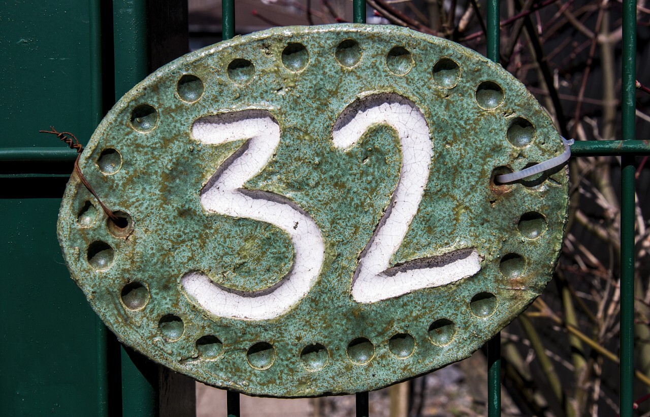 number 32 on a fence