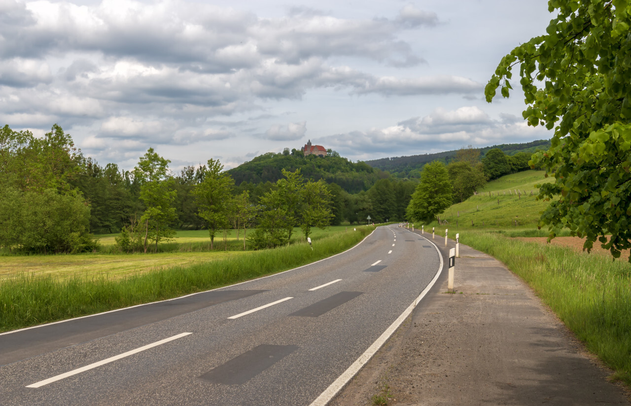 Country road through the rural area of Melsungen in Hesse, Germany