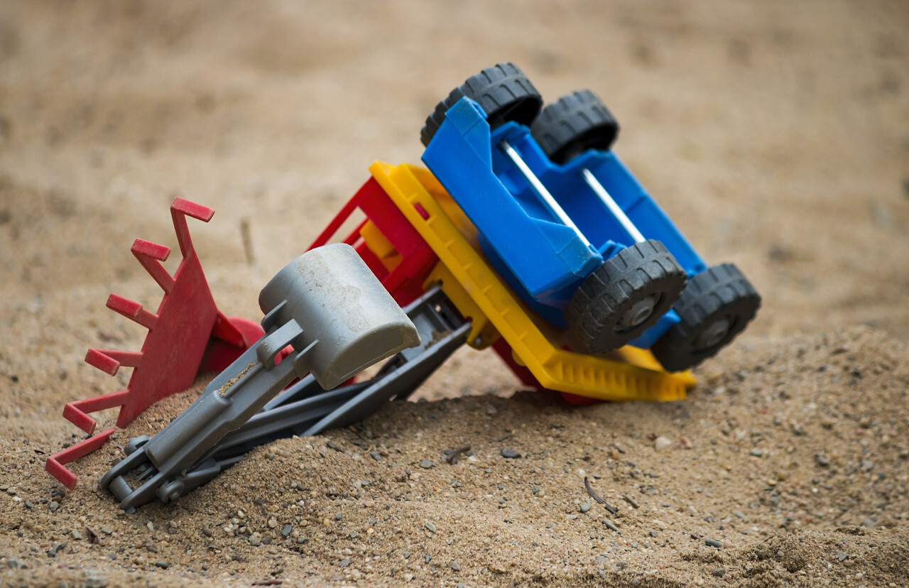 toy excavator in the sandbox