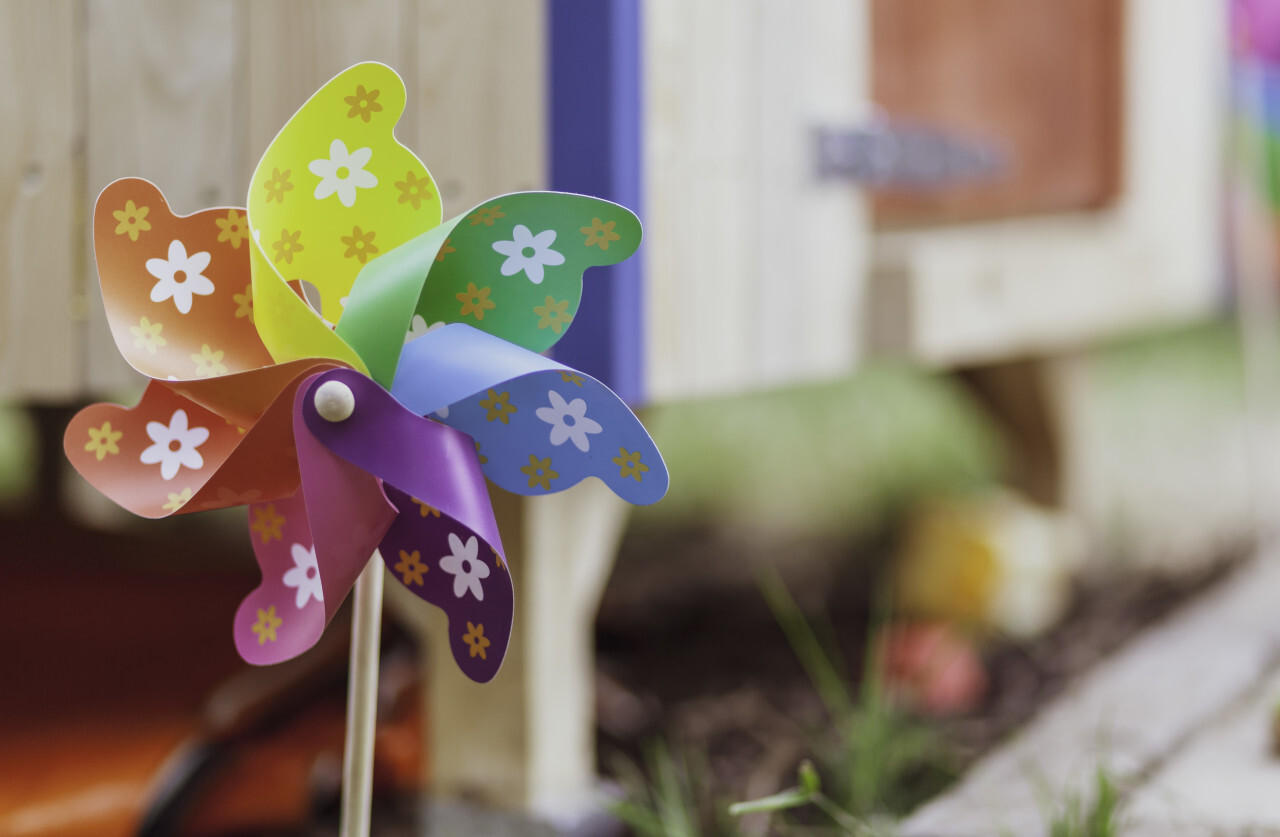 Windmill toy isolated on bokeh background in the garden