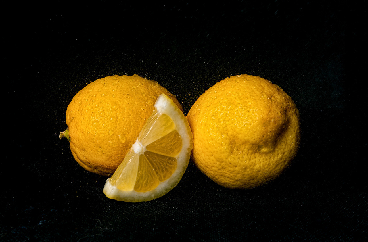 Wet Lemons on black background