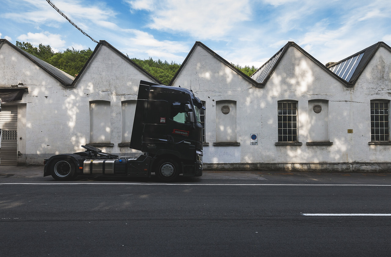 truck in front of an old factory