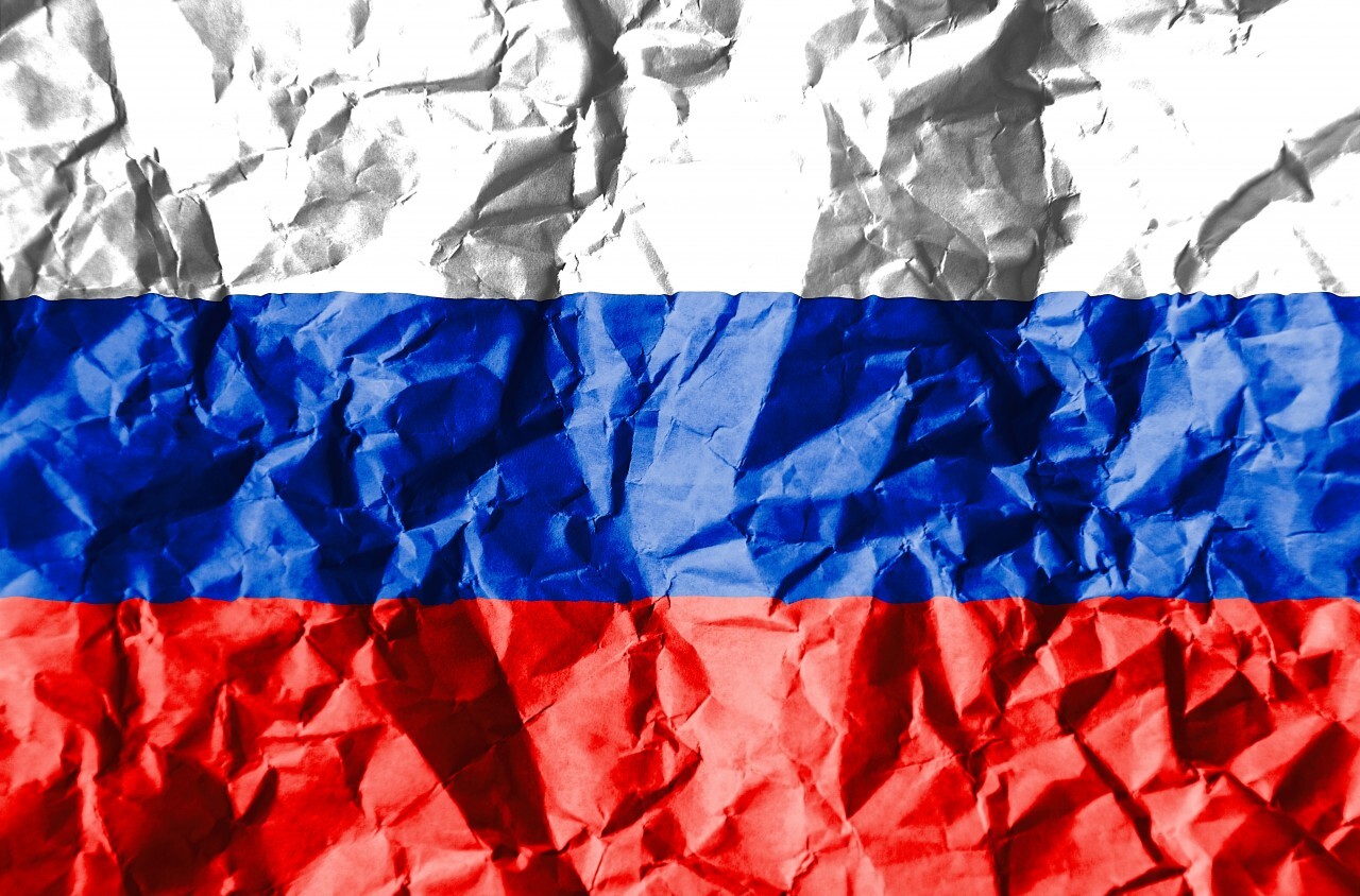 russia flag on crumpled paper