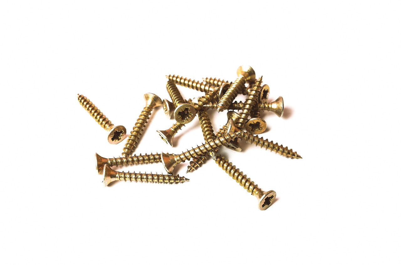 golden wood screws isolated on white background