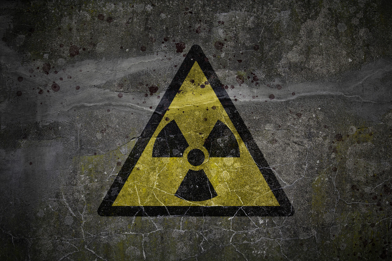 Grunge nuclear radiation symbol background