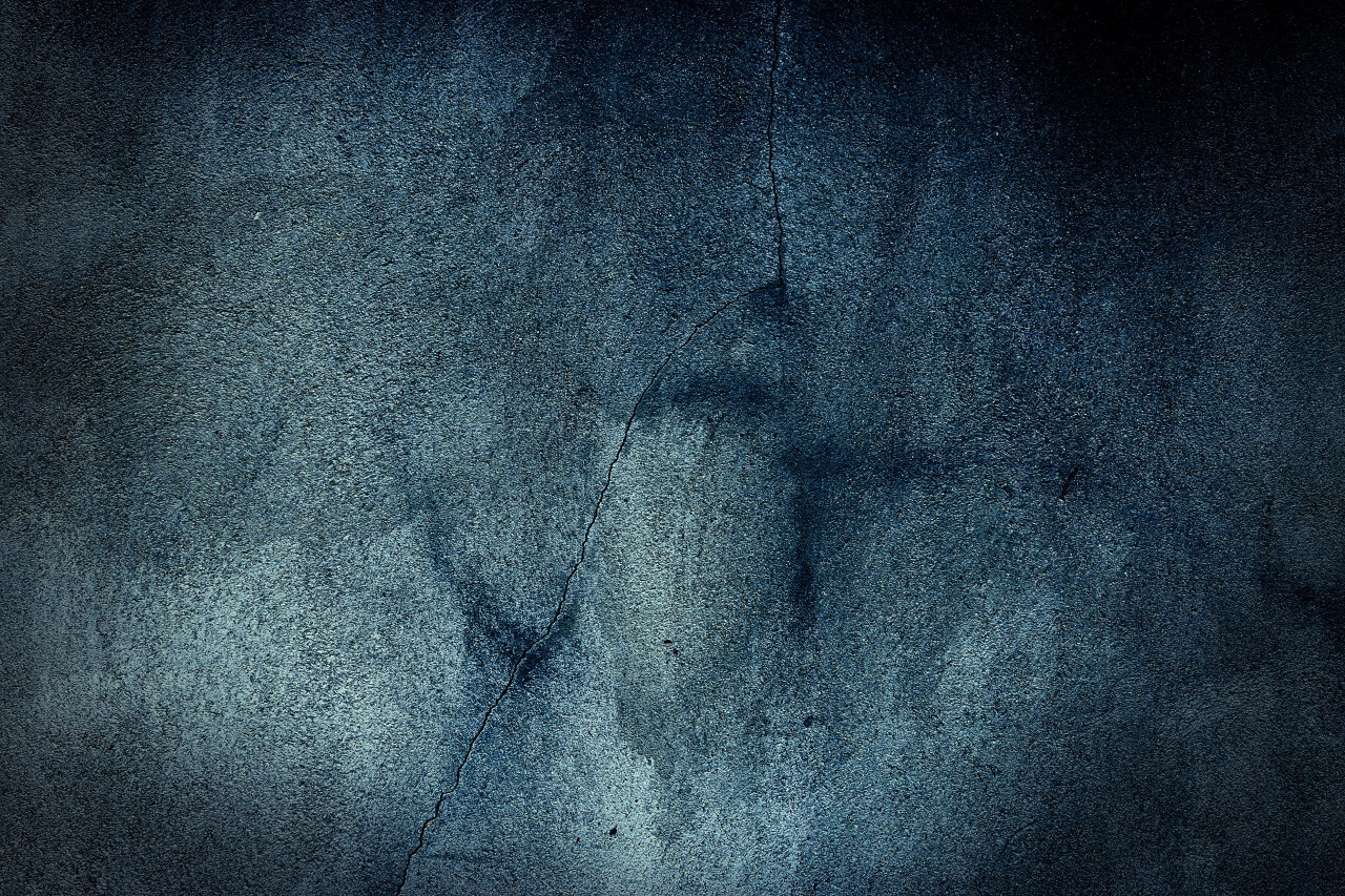 dark blue grunge concrete texture with cracks background