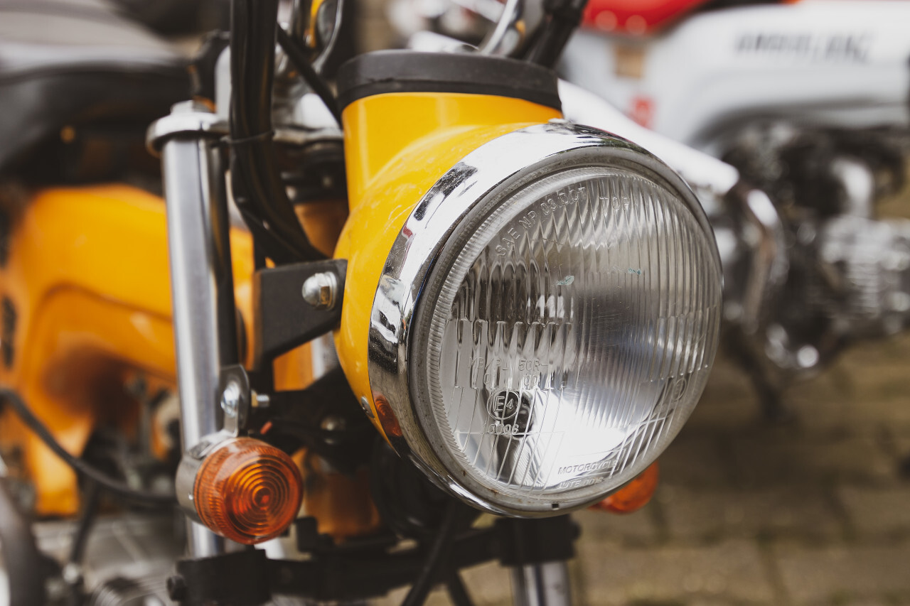 yellow motorcycle detail shot headlight