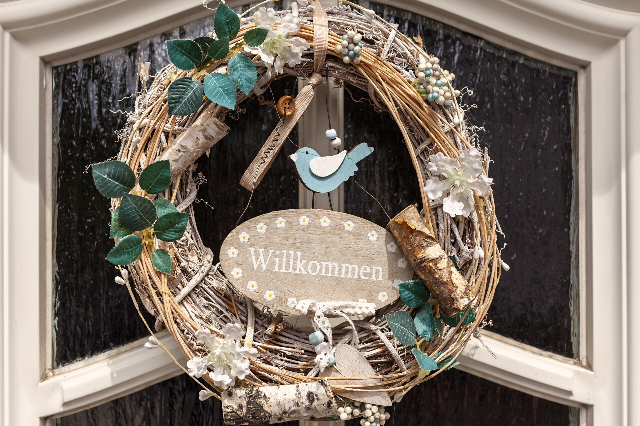 door wreath in germany willkommen means welcome