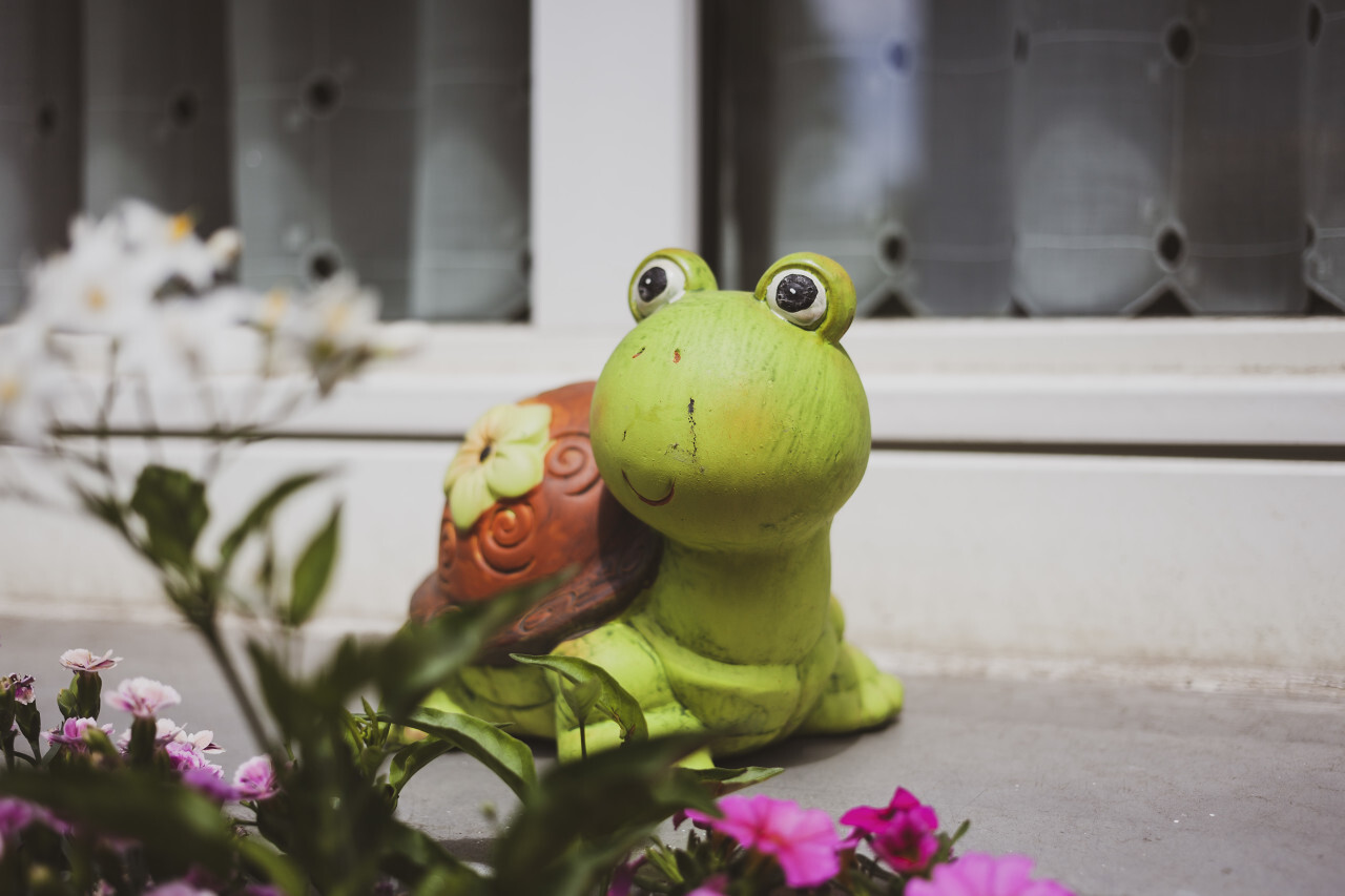 Cute decorative figure of a turtle on a windowsill