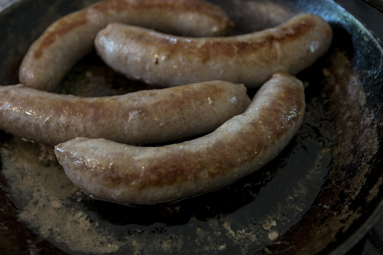 fried sausages in a pan