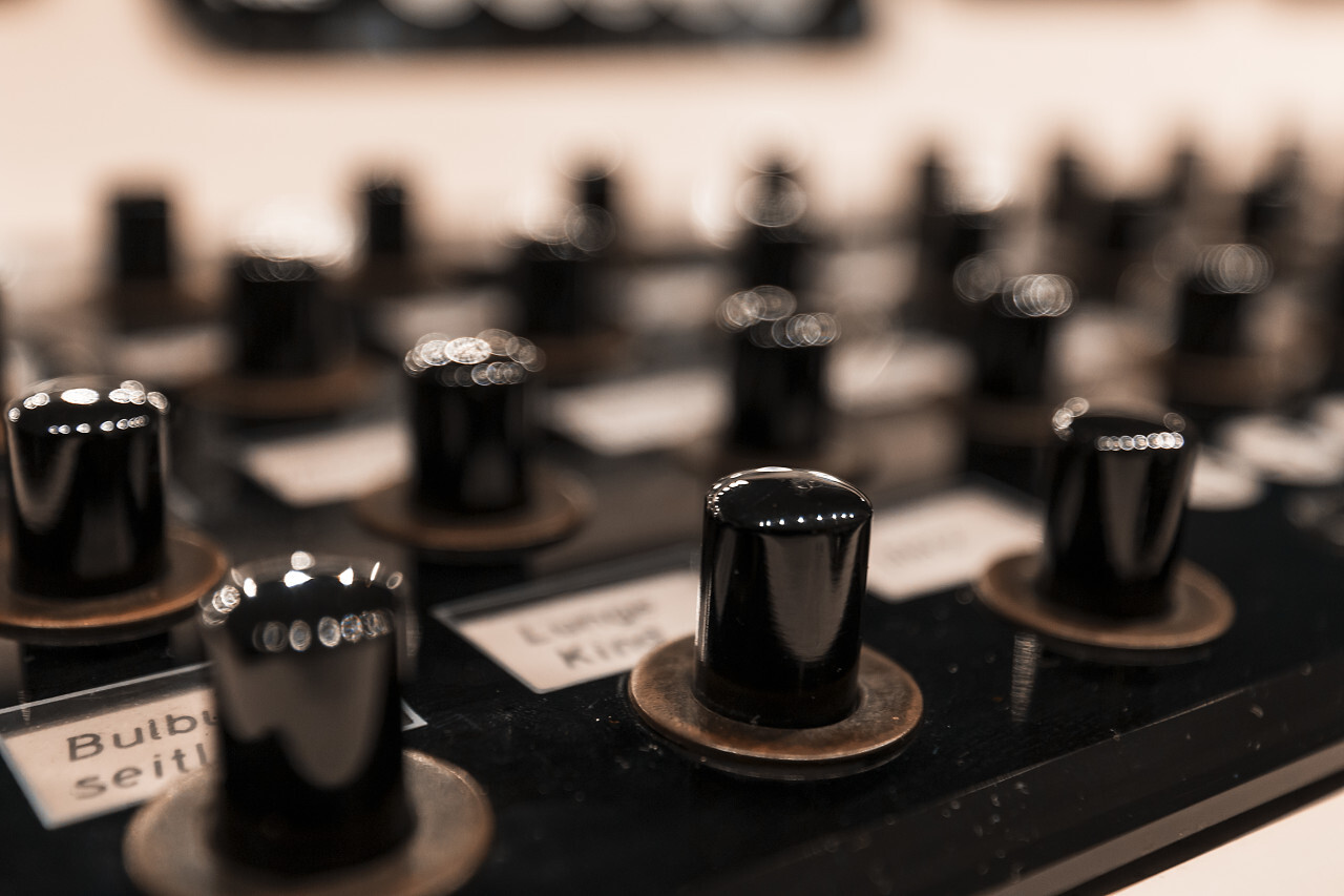 many switches on an old vintage control panel