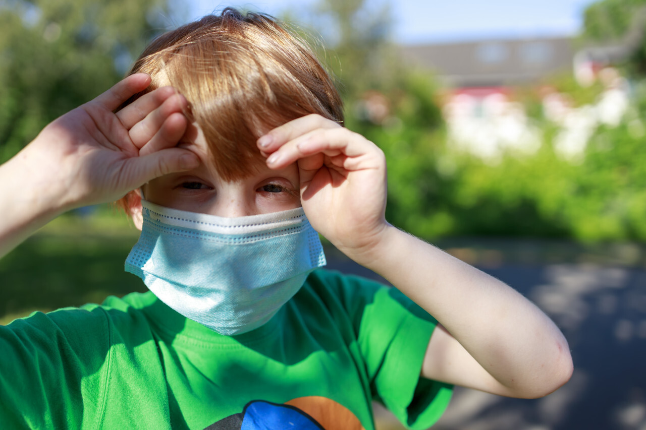 young boy with a mask - protection against covid-19 coronavirus