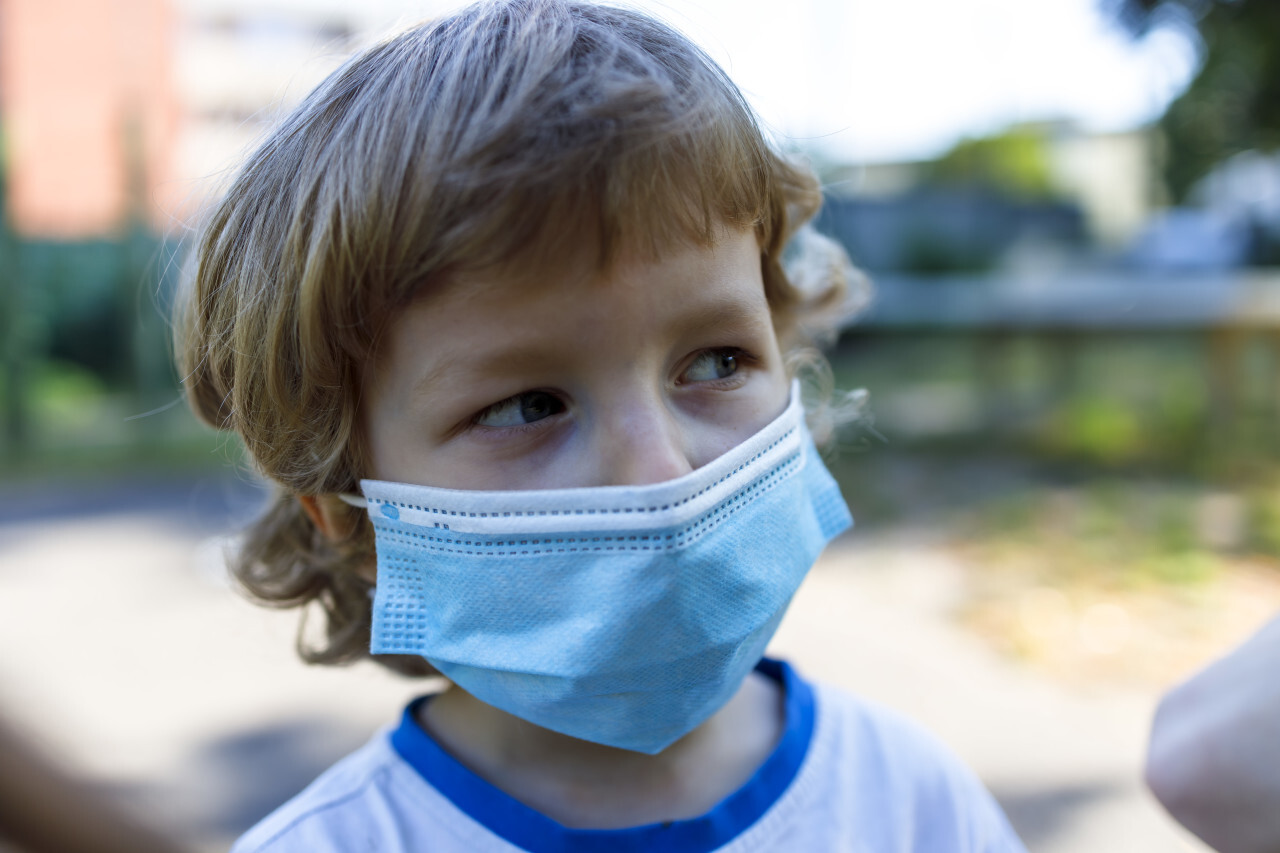 young boy with a mask - protection against covid-19 coronavirus