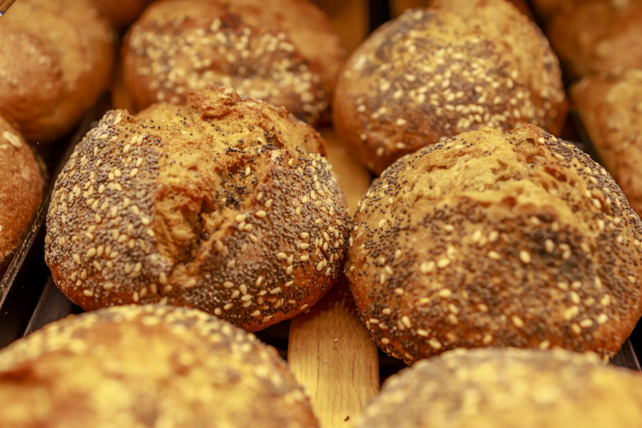 Fresh bread rolls in the bakery with grains