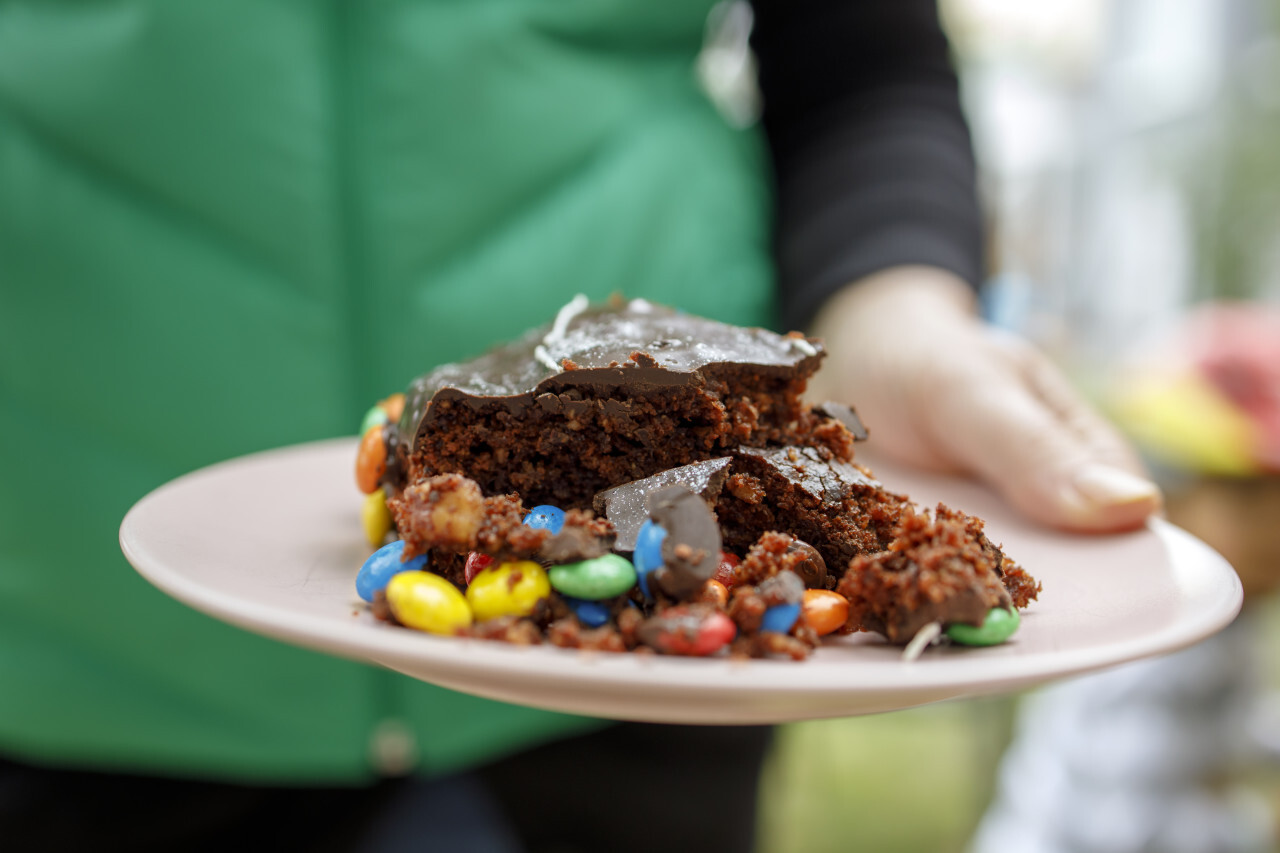 Chocolate cake on a plate at a birthday party in the garden