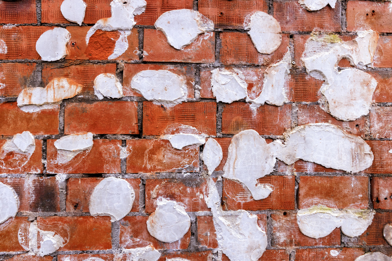 Weathered stained old grunge brick wall texture background