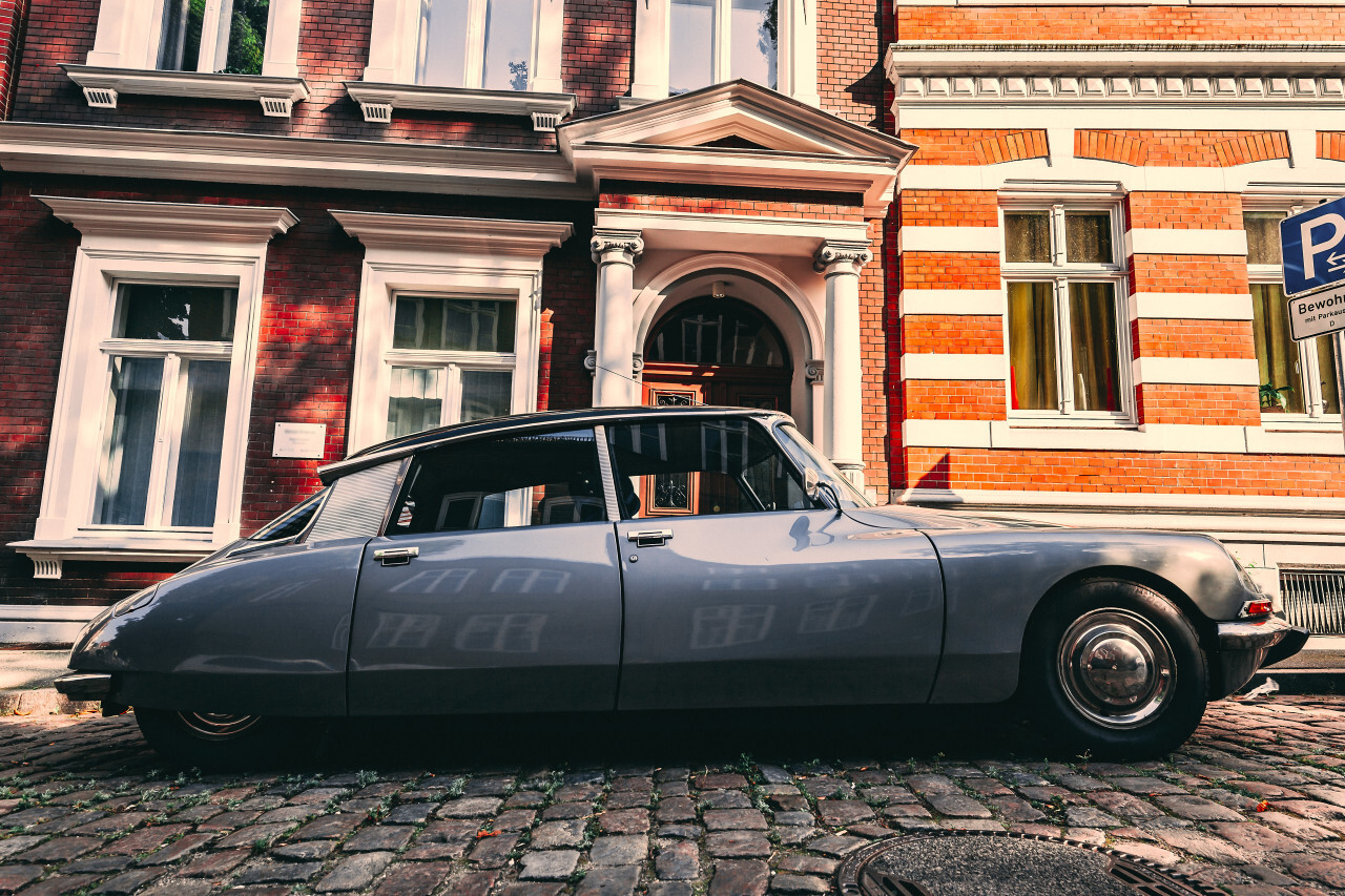 Lübeck, Schleswig-Holstein, Germany - JULY 28, 2019: beautiful old classic car in the medieval old town