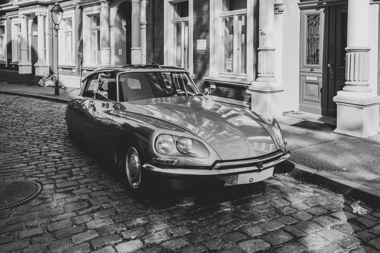 Lübeck, Schleswig-Holstein, Germany - JULY 28, 2019: beautiful old classic car in the medieval old town