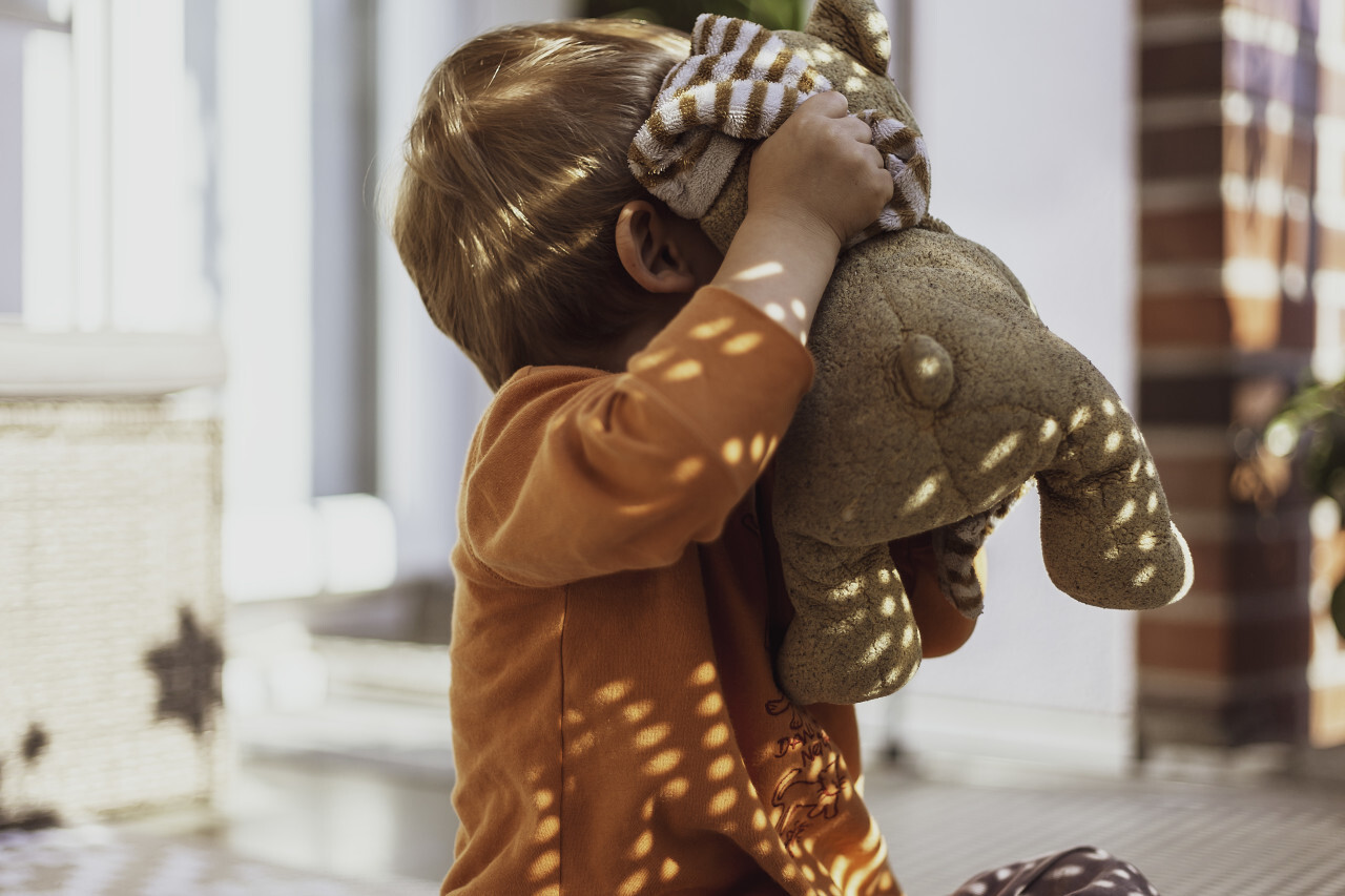 child with beloved teddy