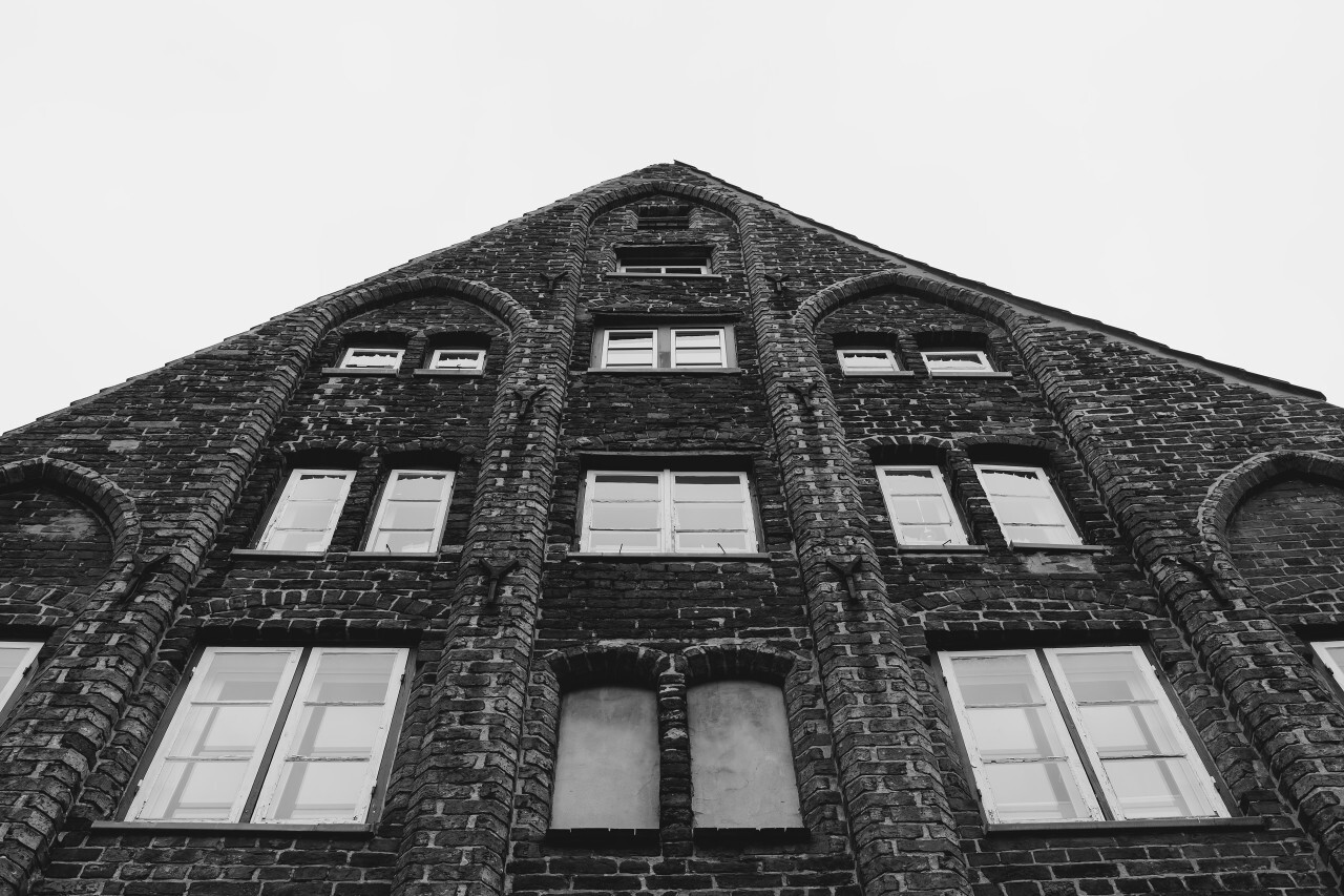 old brick house in lubeck black and white