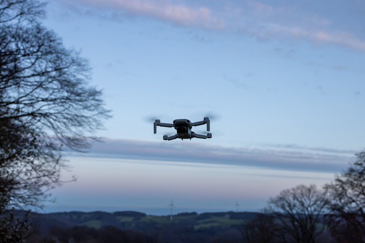 Quadrocopter drone flying in the sky