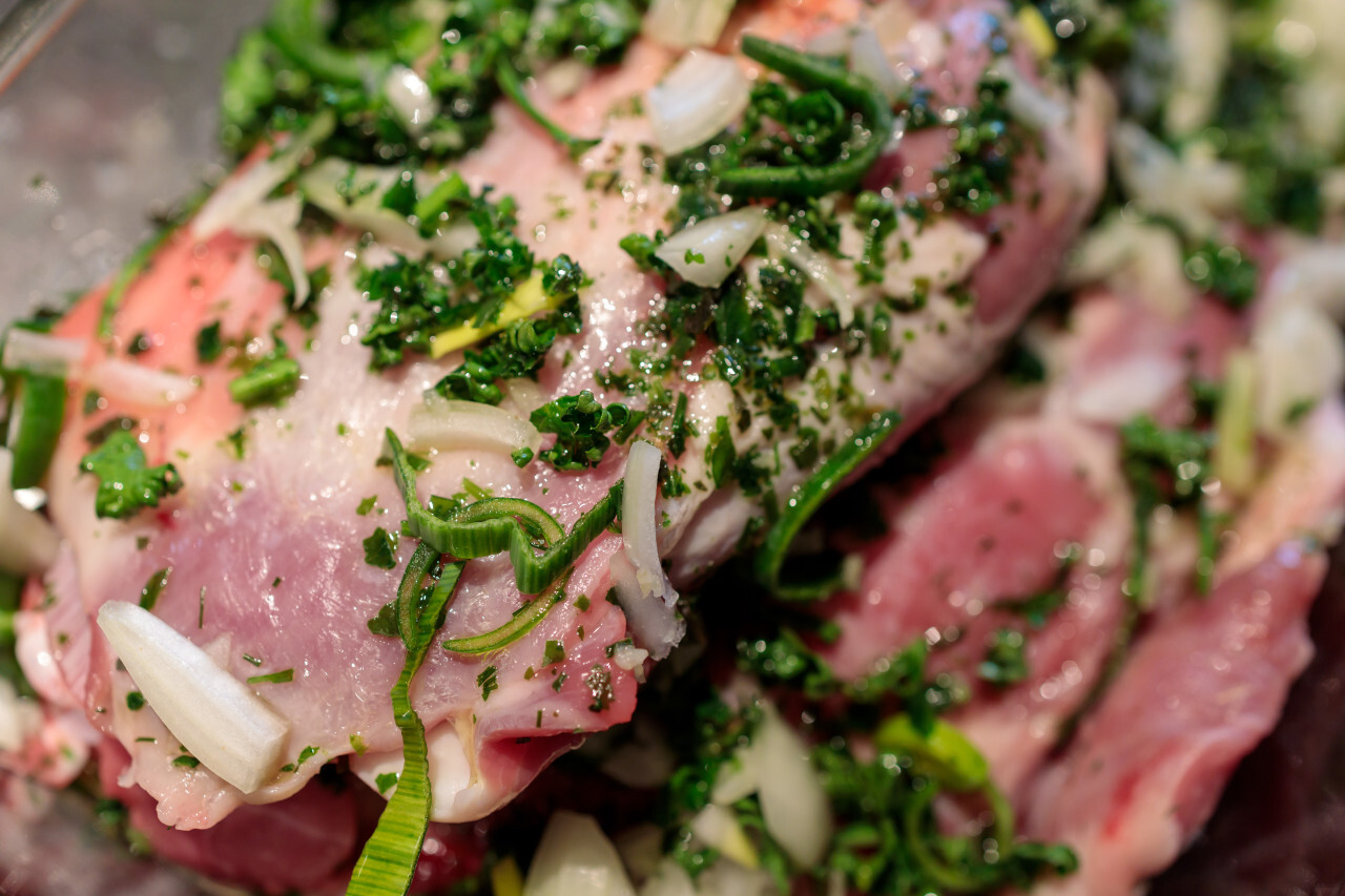 Raw shoulder of lamb pickled in herbs