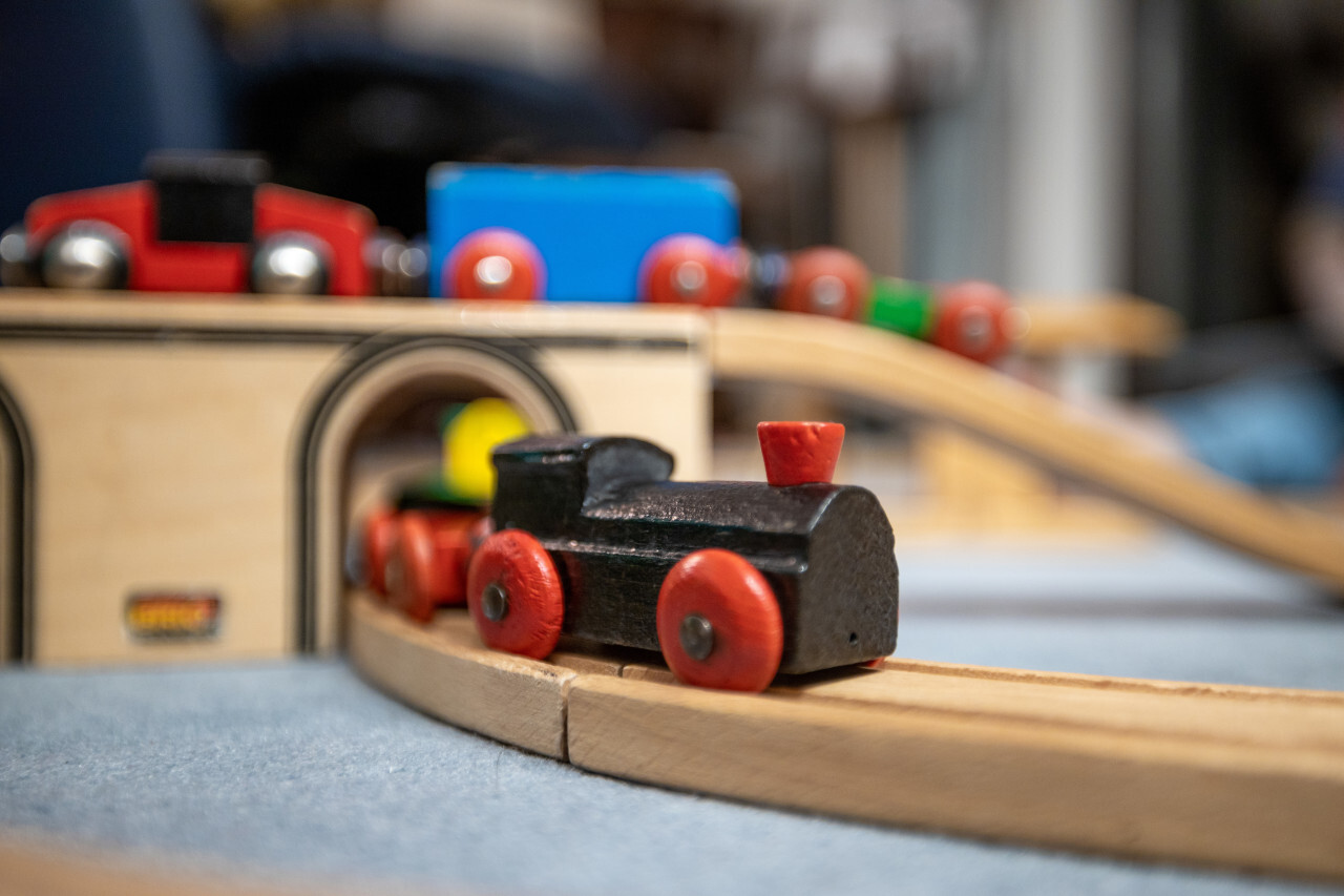 Black wooden train in a child's room