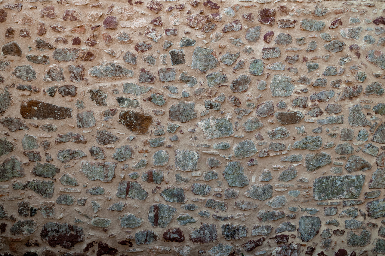 Wall of old medieval stones Texture
