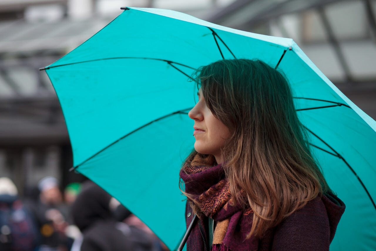 Woman with turquoise umbrella