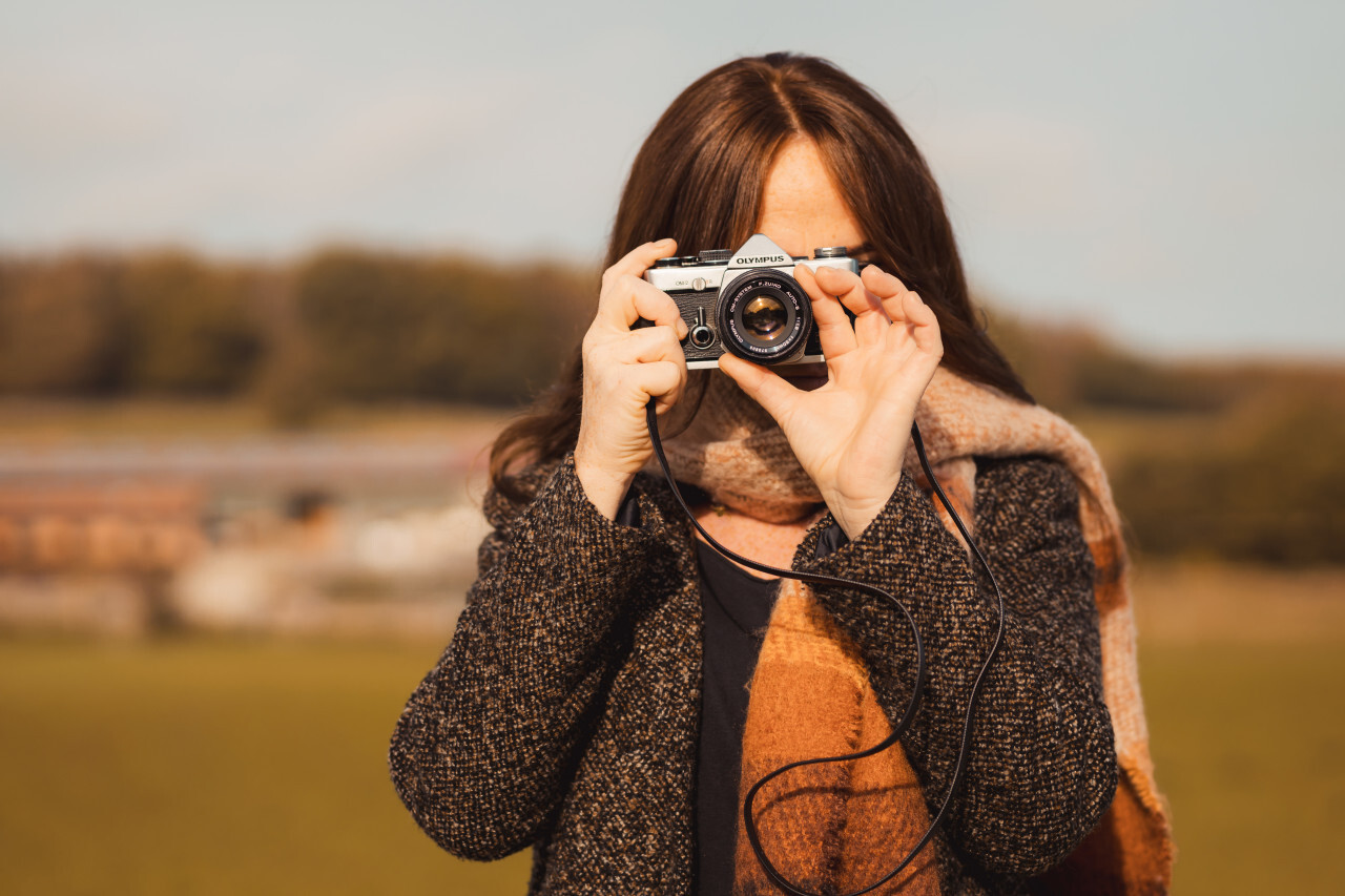 Female photographer with analog camera