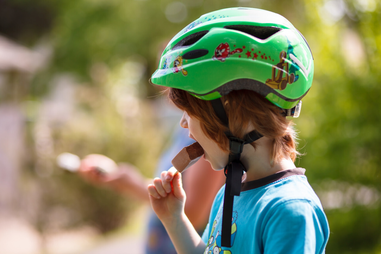 Little boy eats chocolate ice cream